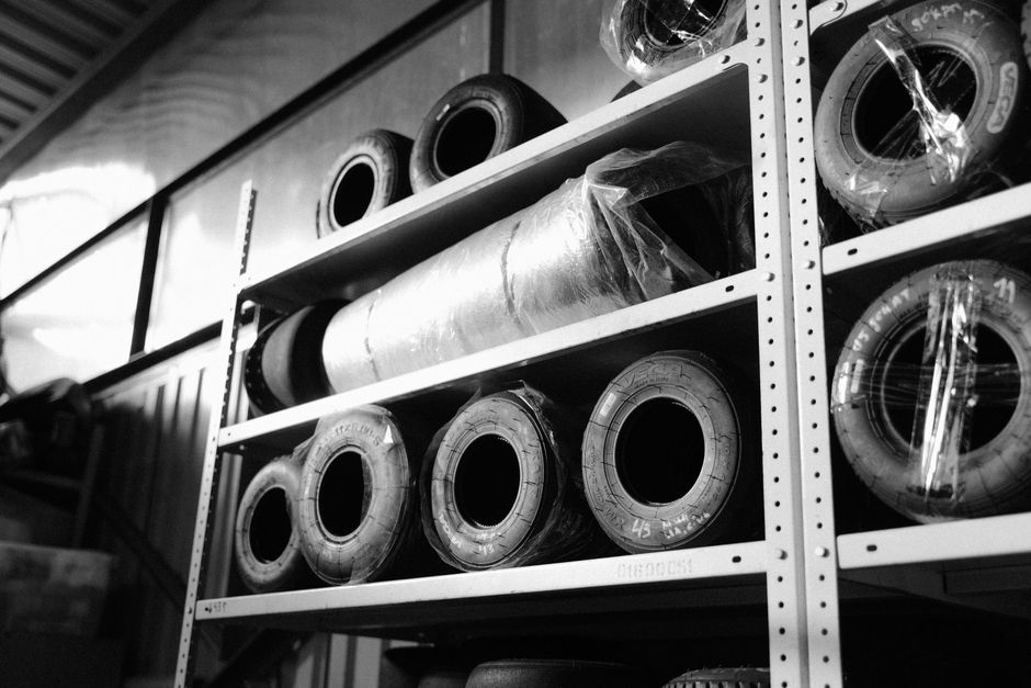 Off-season tires stored securely on warehouse racks